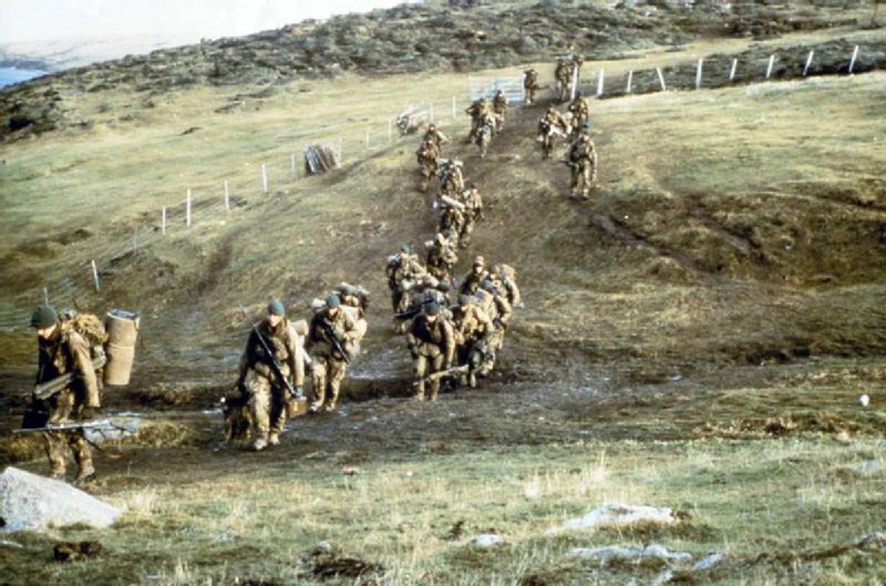 Royal Marines marching with heavy loads